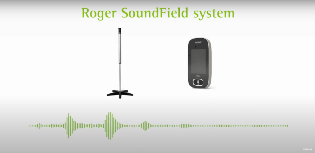 Roger SoundField system showing a classroom speaker on a stand and a wireless microphone used to improve speech clarity in group settings.