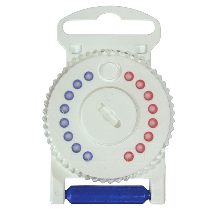 A white circular dispenser wheel containing 8 red wax guards on the right side and 8 blue wax guards on the left side, with a blue filter replacement tool attached at the bottom. Used for maintaining hearing aids.