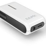 Oticon EduMic device lying flat, showcasing its compact, rectangular design with a white body and black side panel. The device has a visible button on the side and audio input ports on the front, next to the EduMic branding. It is designed to wirelessly transmit clear audio directly to hearing aids