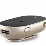 A compact, beige and black assistive listening Phonak PartnerMic device featuring a clip on the bottom for attaching to clothing. The front side has a USB port labeled '500mA' for charging, and a small button marked with a Bluetooth symbol. The device also has an on/off switch on the side and a sleek, curved design.