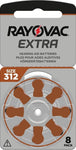 Packaging of Rayovac Extra hearing aid batteries, Size 312, 6-pack. The front of the package is gray with brown accents, featuring the Rayovac Extra logo with a red and black lightning bolt. A wheel of six batteries, marked with brown tabs, is visible through a transparent section.