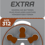 Packaging of Rayovac Extra hearing aid batteries, Size 312, 6-pack. The front of the package is gray with brown accents, featuring the Rayovac Extra logo with a red and black lightning bolt. A wheel of six batteries, marked with brown tabs, is visible through a transparent section.