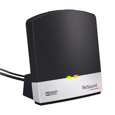 This image shows the ReSound Unite TV Streamer 2, a sleek black device with a silver bottom edge. The device features two indicator lights (green and orange) and is branded with "ReSound" and "Dolby Digital" logos. It is designed to connect with cochlear devices, baha and ReSound hearing aids to stream audio directly from a TV or other audio sources.