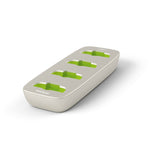 Empty Roger Charging Rack showing four charging slots with green accents, designed to power multiple Phonak Roger educational devices at once using a single dock