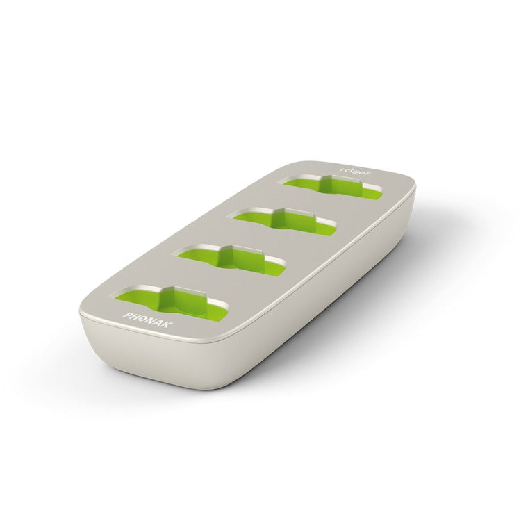 Empty Roger Charging Rack showing four charging slots with green accents, designed to power multiple Phonak Roger educational devices at once using a single dock