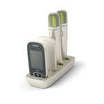 Roger Charging Rack with four Phonak Roger devices inserted two Pass-around Microphones and two Touchscreen Mics charging simultaneously in a compact, organised dock for classroom use.
