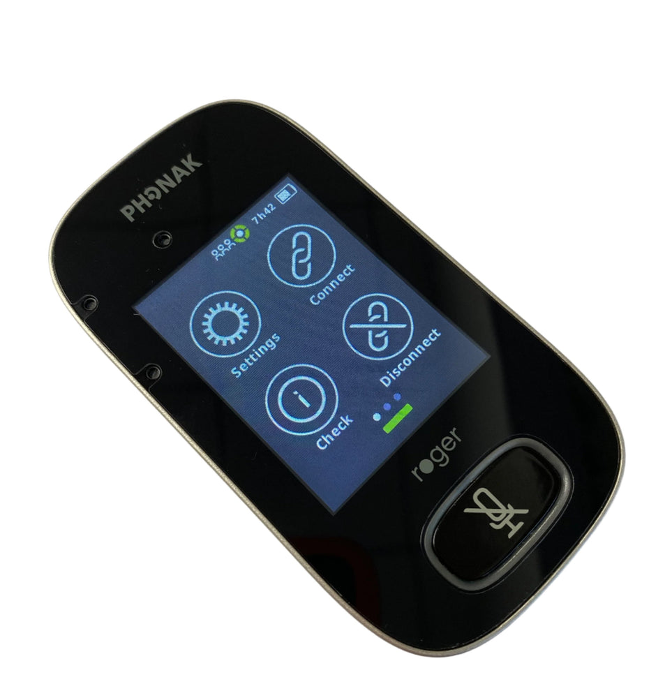 The image shows a close-up of a Phonak Roger device, displaying its touchscreen interface. The screen has four icons: Settings, Connect, Disconnect, and Check, along with an information icon in the middle. A green indicator is visible at the bottom of the screen, indicating the device's battery or connection status. The device has a sleek black finish with the Phonak and Roger logos at the top and bottom.