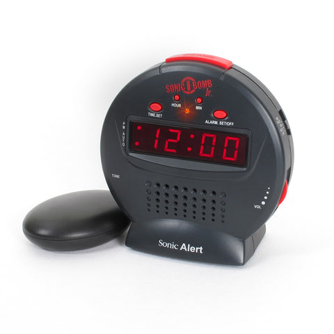 The Sonic Bomb Alarm Clock and vibrating pad in black with a red display